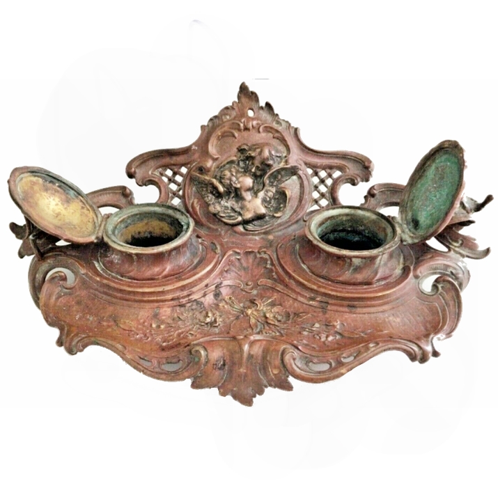 The bronze ink stand, its wells open