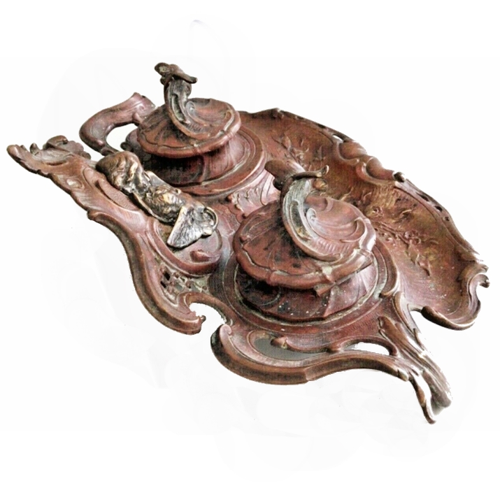 A carved rococo ink stand with two lidded wells and bronze mounts